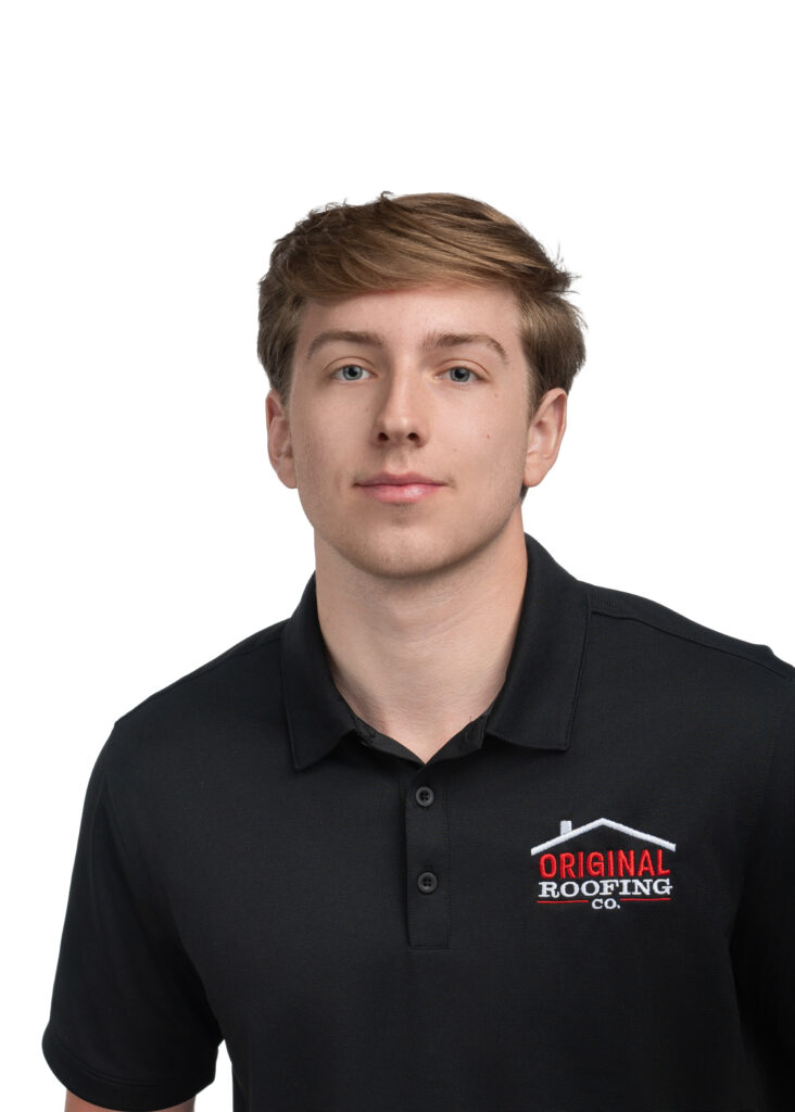 Man wearing a black polo shirt with the logo "Original Roofing Co." printed on it, representing a trusted roofing contractor, standing against a plain white background.